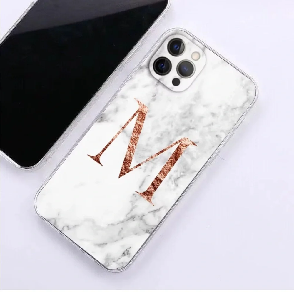 White marble pattern iPhone 13 Pro Max case with a large Rose Gold Letter M